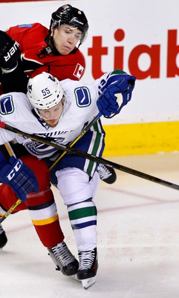 Brodie stays hot with 3 assists, Flames beat Canucks 5-2